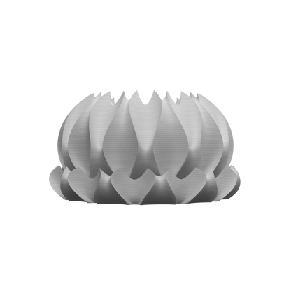 Pot décoratif blanc mat en forme de pétales incurvés superposés, style moderne et sculptural.