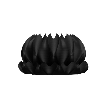 Pot décoratif noir mat en forme de fleur stylisée avec pétales incurvés et surface texturée moderne.