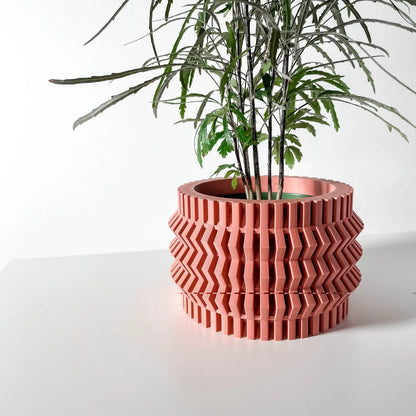 Pot décoratif Alio en plastique durable couleur orange au design contemporain sculpté de motifs géométriques en relief,.