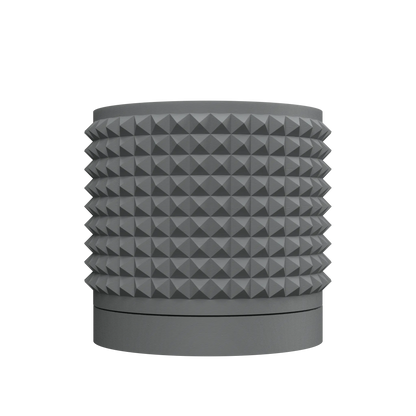 Pot décoratif Anver gris anthracite, forme cylindrique avec surface texturée de pyramides tridimensionnelles, base lisse.