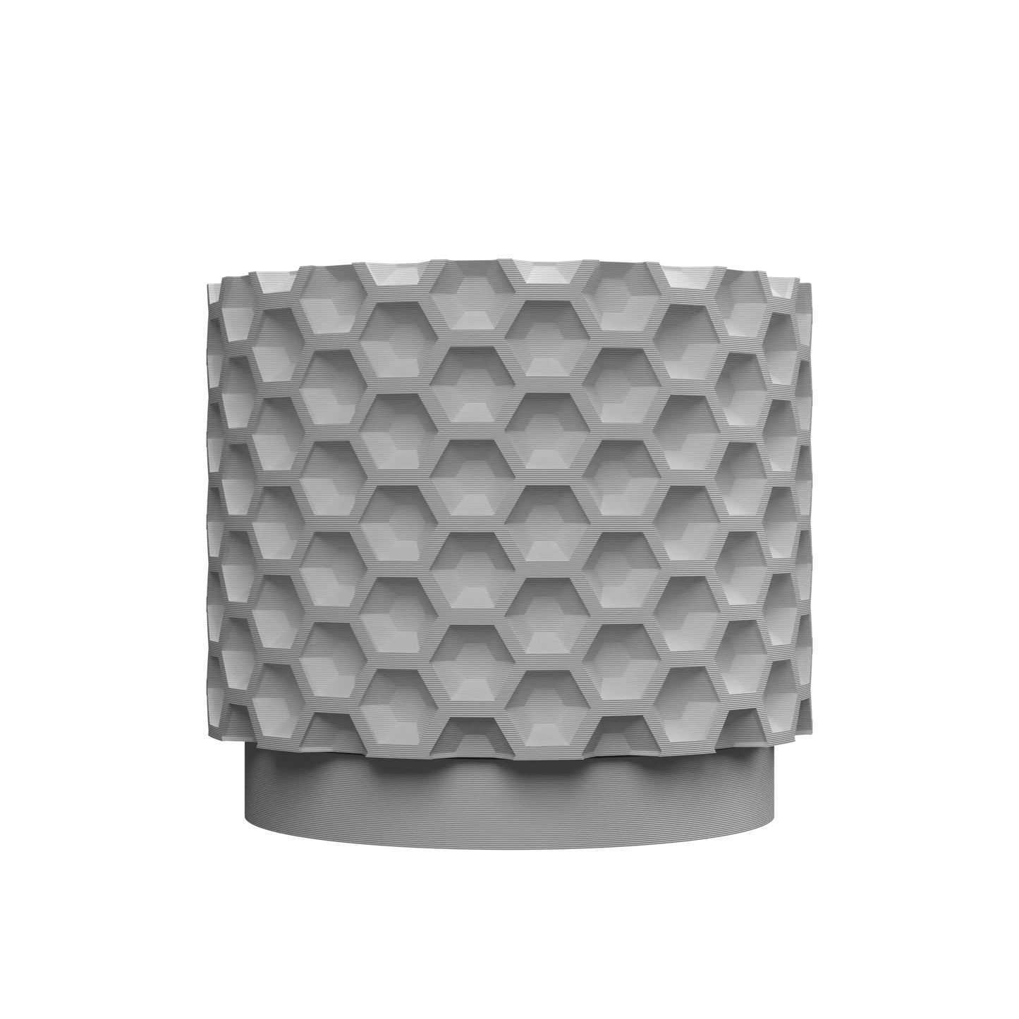 Pot décoratif gris clair avec surface texturée en motif hexagonal en relief, forme cylindrique et base légèrement surélevée.
