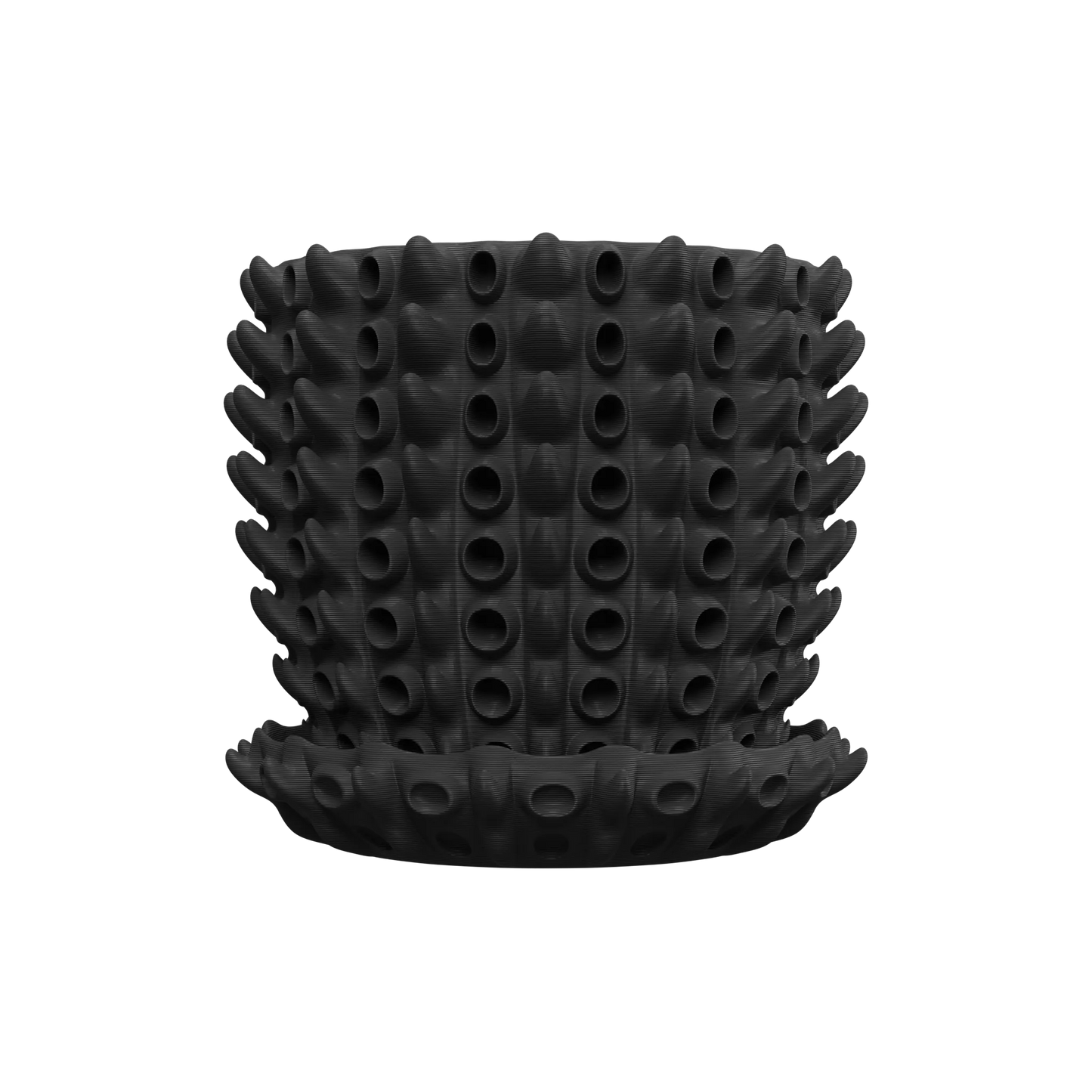 Pot décoratif noir mat en silicone avec motif de protubérances tubulaires cylindriques uniformes, accompagné d'une soucoupe.