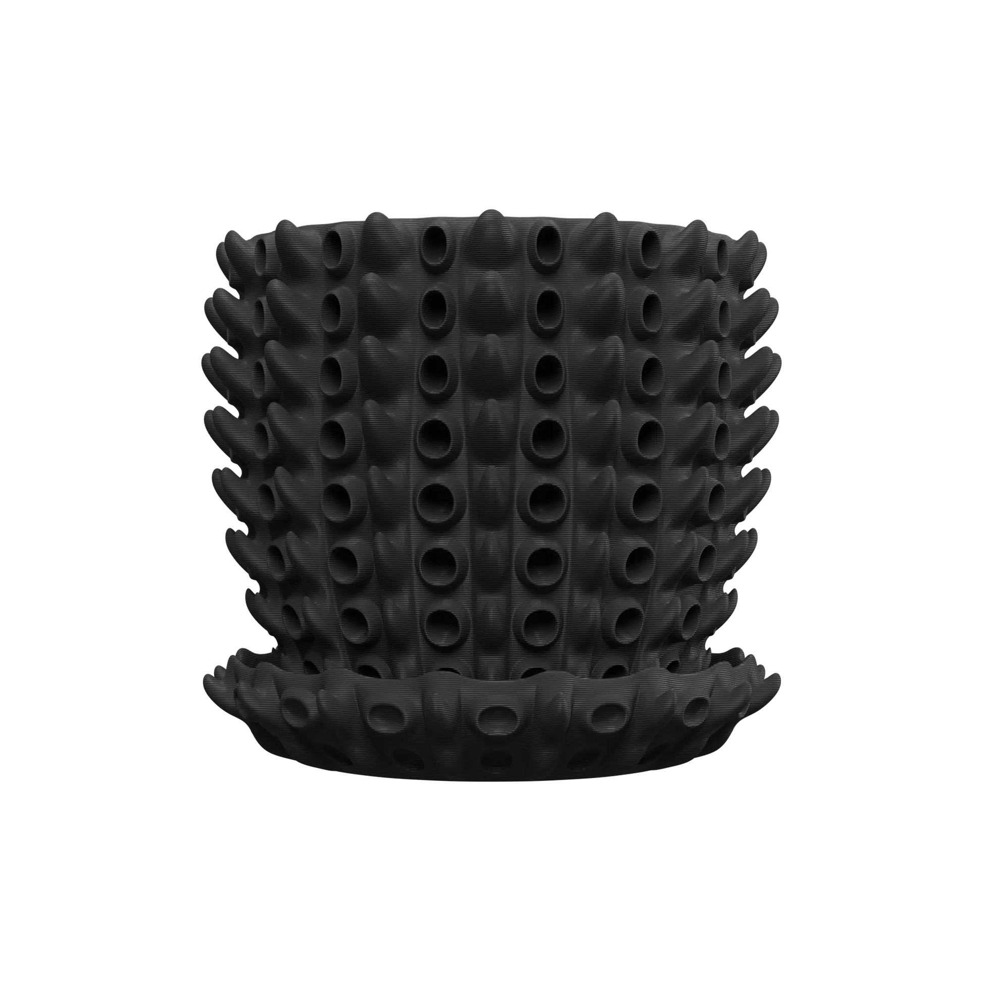 Pot décoratif noir mat en silicone avec motif de protubérances tubulaires cylindriques uniformes, accompagné d'une soucoupe.