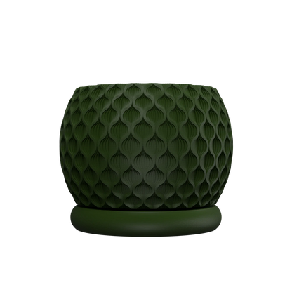 Pot décoratif vert foncé avec texture géométrique en relief rappelant des écailles, forme arrondie et base plate.
