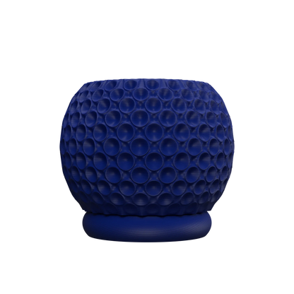 Pot décoratif rond bleu foncé avec surface texturée en relief de bulles géométriques, base plate légèrement surélevée.