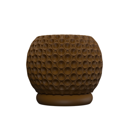 Pot décoratif marron à surface texturée avec motif de bulles rondes en relief, forme arrondie sur pied circulaire.