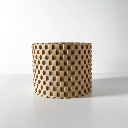 Pot décoratif cylindrique beige avec texture en relief en forme de cubes réguliers, style moderne et minimaliste.