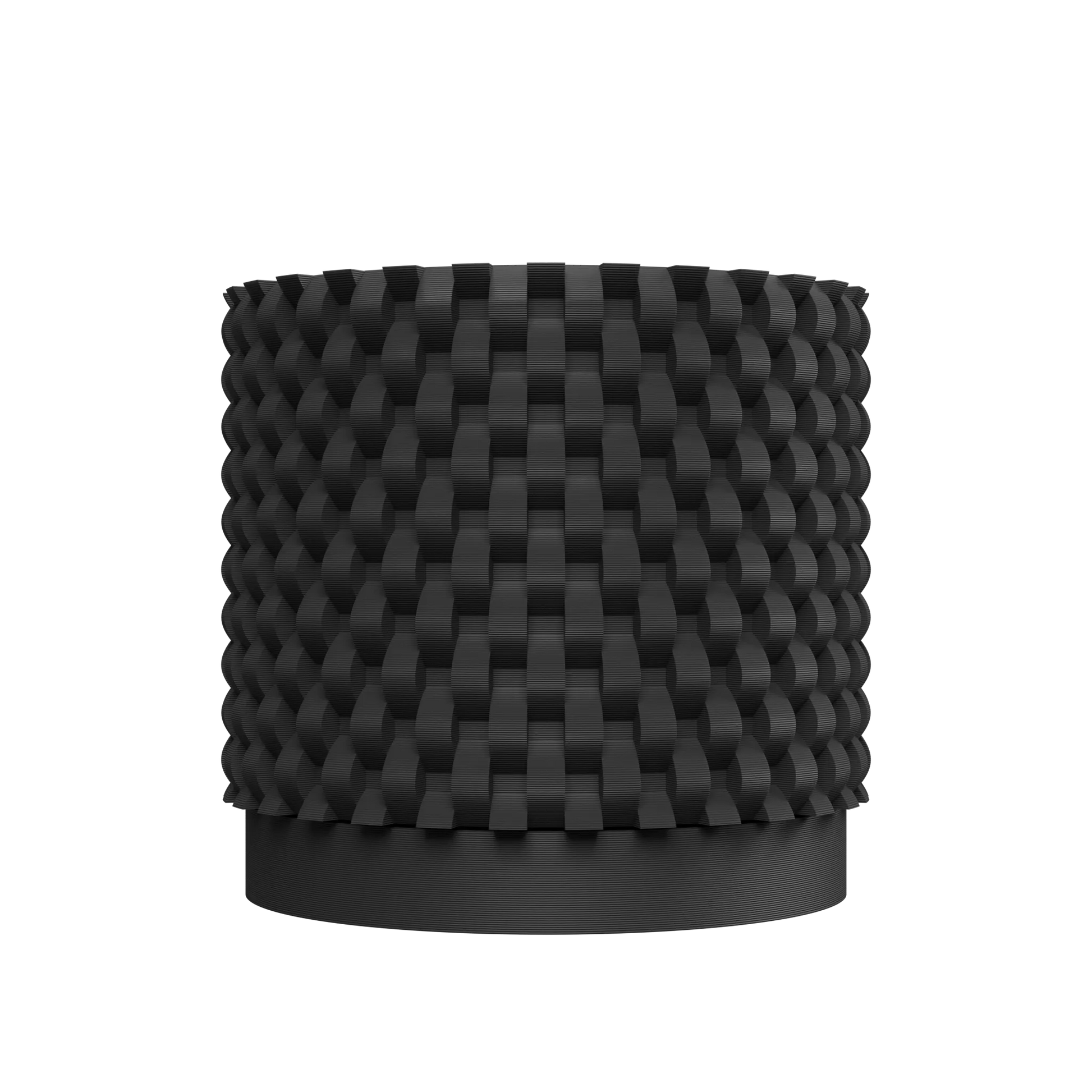 Pot décoratif cylindrique noir mat avec surface texturée en relief géométrique carré, design moderne et élégant.