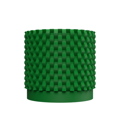 Pot décoratif vert en plastique avec surface texturée en relief en motifs géométriques carrés, forme cylindrique.