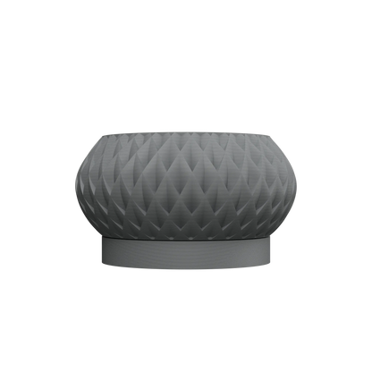Pot décoratif gris mat avec texture géométrique en relief, forme arrondie et base stable.