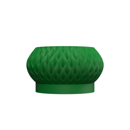 Pot décoratif vert foncé avec texture géométrique en relief, forme ronde et base plate.