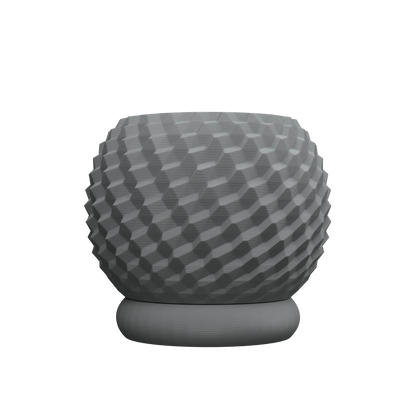 Pot décoratif gris foncé en matière mate avec surface texturée en relief géométrique, base ronde plate.