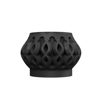 Pot décoratif noir mat avec motifs géométriques entrelacés, forme large et arrondie, base stable.
