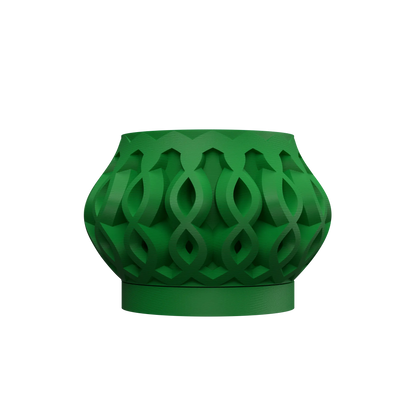 Pot décoratif vert foncé avec motif géométrique ajouré en spirales entrelacées, forme bombée et base circulaire robuste.