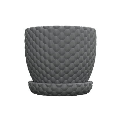 Pot décoratif gris foncé avec motif en relief évoquant des écailles de dragon, forme cylindrique arrondie, surface texturée.