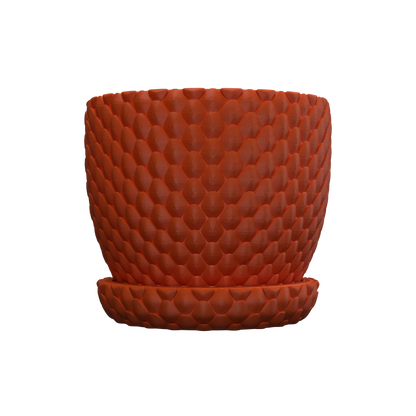 Pot décoratif orange en plastique avec motif écailles de dragon en relief, forme cylindrique et soucoupe assortie.