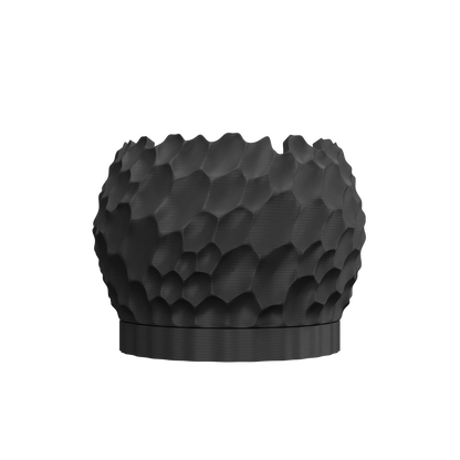 Pot décoratif noir mat à texture en relief irrégulière imitant des ondulations dune, forme arrondie avec base plate robuste.