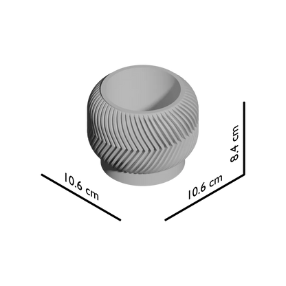 Pot décoratif rond gris clair avec motifs géométriques en relief et base circulaire légèrement surélevée.