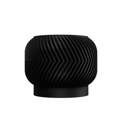 Pot décoratif rond noir avec motif en zigzag texturé et base plate rehaussée, design moderne.