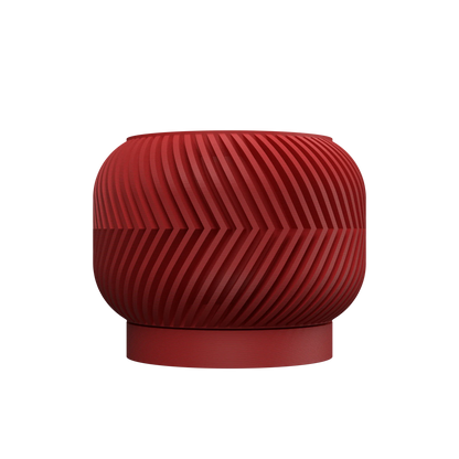 Pot décoratif Ervon rouge avec surface texturée en lignes courbes, design contemporain et durable en plastique moulé.