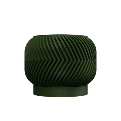 Pot décoratif vert foncé avec texture rainurée en spirale et forme arrondie sur base circulaire.