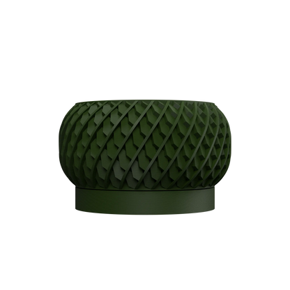 Pot décoratif rond vert foncé avec motif géométrique en relief et base lisse circulaire.