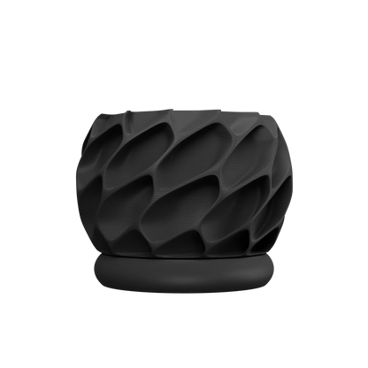 Pot décoratif noir mat avec texture géométrique en relief et base ronde lisse, style moderne.