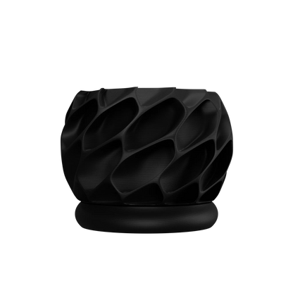 Pot décoratif noir mat avec surface texturée en motifs géométriques creusés, design moderne et épuré.