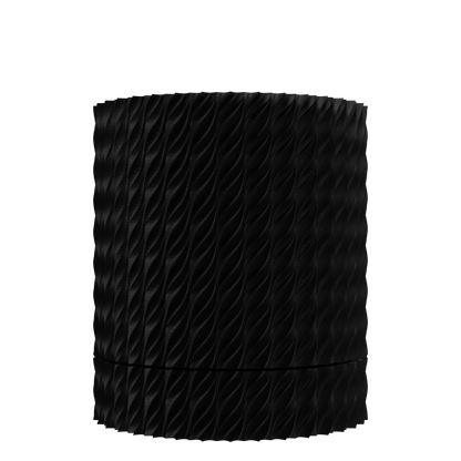 Pot décoratif noir mat avec motifs en relief ondulés, forme cylindrique élancée et surface texturée moderne.