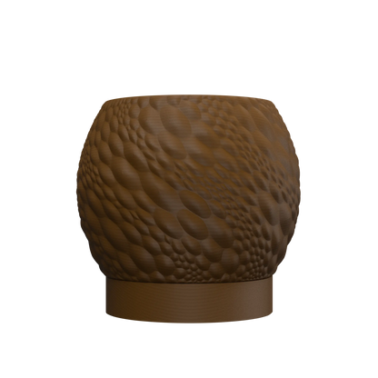 Pot décoratif rond en métal brun avec surface texturée en relief imitant des motifs organiques, base lisse et épaisse.