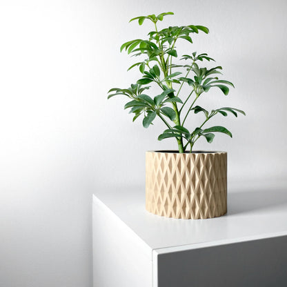Pot décoratif anthracite en matériau durable avec texture géométrique, design contemporain, plante verte à l'intérieur posé.