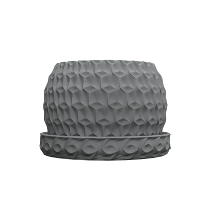 Pot décoratif hexagonal gris foncé avec surface texturée en motif géométrique en relief, accompagné d’une base assortie.