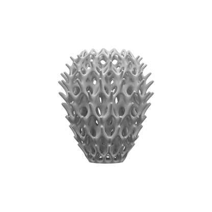 Vase blanc mat aux formes organiques ajourées, silhouette arrondie avec motifs ondulés en relief style moderne machine.