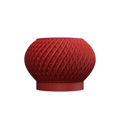 Pot décoratif rouge brique en matériau moderne avec motif texturé en relief torsadé, forme arrondie et base plate.