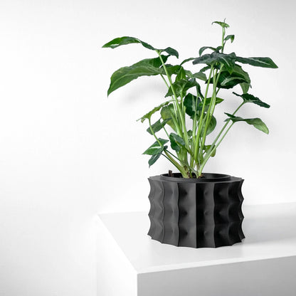 Pot décoratif noir en matériau durable avec motifs ondulés, design contemporain et moderne.