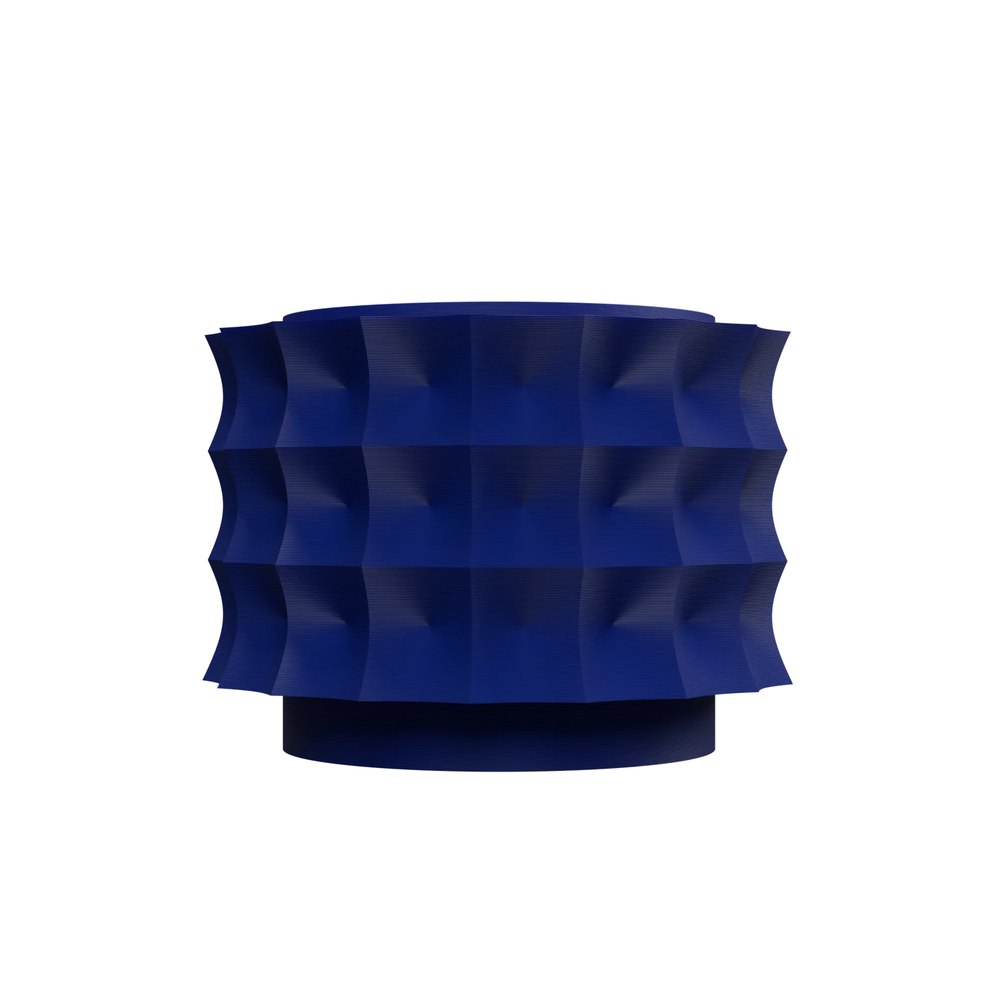 Pot décoratif moderne bleu foncé avec surface sculptée en motifs géométriques en relief, forme cylindrique large.