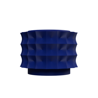 Pot décoratif moderne bleu foncé avec surface sculptée en motifs géométriques en relief, forme cylindrique large.
