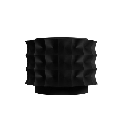 Pot décoratif noir mat avec surface texturée en relief géométrique ondulé, forme cylindrique moderne et base légèrement.