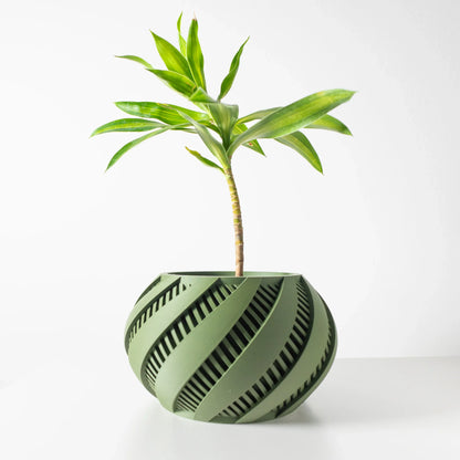 Pot décoratif Krato vert forêt en matériau durable avec design contemporain à motifs spirales découpés.
