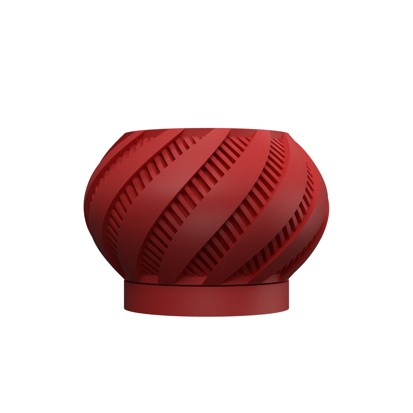 Pot décoratif rond rouge mat avec motifs en spirale ajourés et base circulaire plate.