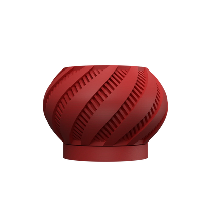 Pot décoratif rond rouge mat avec motifs en spirale ajourés et base circulaire plate.