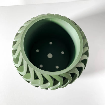 Pot décoratif vert forêt en matériau durable à design contemporain avec reliefs en forme de spirale, vue plongeante montrant .