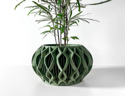 Pot décoratif en plastique vert forêt durable avec design contemporain et motifs géométriques creux.