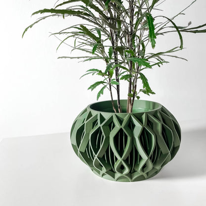 Pot décoratif Octa vert forêt en matériau durable avec design contemporain ajouré et structure géométrique moderne.