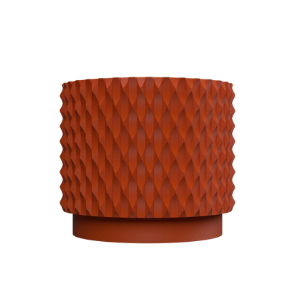 Pot décoratif durable couleur orange avec surface texturée en relief au design contemporain et forme cylindrique.