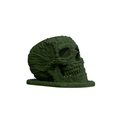 Pot décoratif en forme de crâne vert foncé avec texture détaillée imitant des fissures et reliefs réalistes, positionné sur.