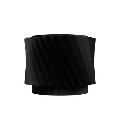 Pot décoratif noir mat en métal avec surface torsadée et forme cylindrique moderne.